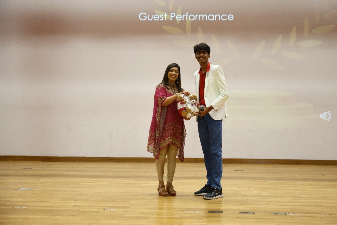 A token of appreciation for our guest following an engaging performance.