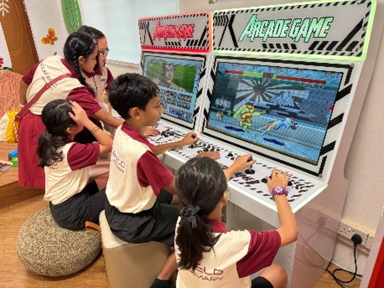 Students playing arcade games
